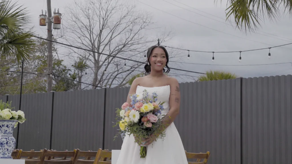 Bride smiling with her bouquet at the Sokol wedding in Charleston, SC